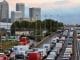 Traffic queues on a main route into London by the towers of London's financial district Canary Wharf on October 28, 2013 after a strong storm causes travel disruption. Britain faced travel chaos on October 28 and over 200,000 homes were without power as one of the worst storms in years battered southern England, sweeping at least one person out to sea. AFP PHOTO / BEN STANSALL (Photo credit should read BEN STANSALL/AFP/Getty Images)