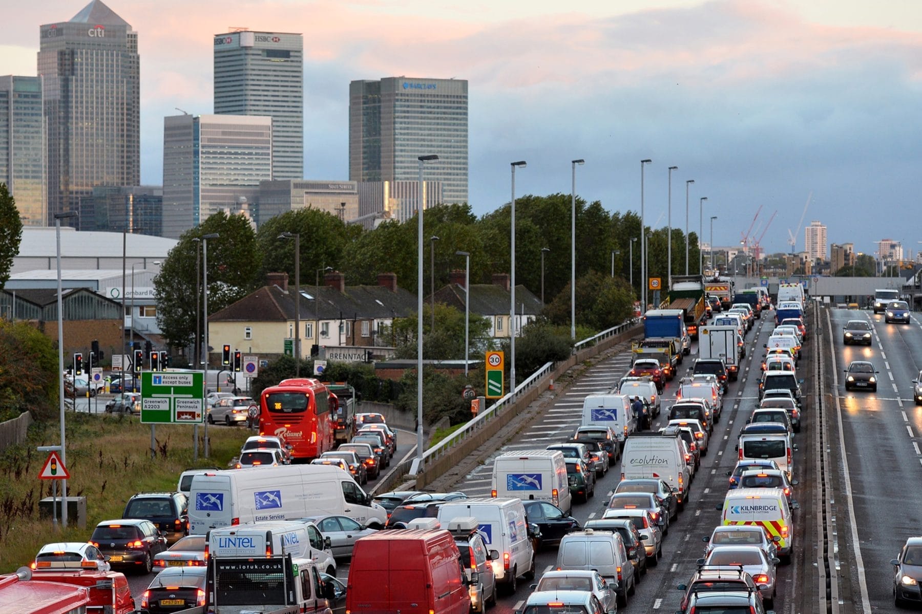 Traffic queues on a main route into London by the towers of London's financial district Canary Wharf on October 28, 2013 after a strong storm causes travel disruption. Britain faced travel chaos on October 28 and over 200,000 homes were without power as one of the worst storms in years battered southern England, sweeping at least one person out to sea. AFP PHOTO / BEN STANSALL        (Photo credit should read BEN STANSALL/AFP/Getty Images)