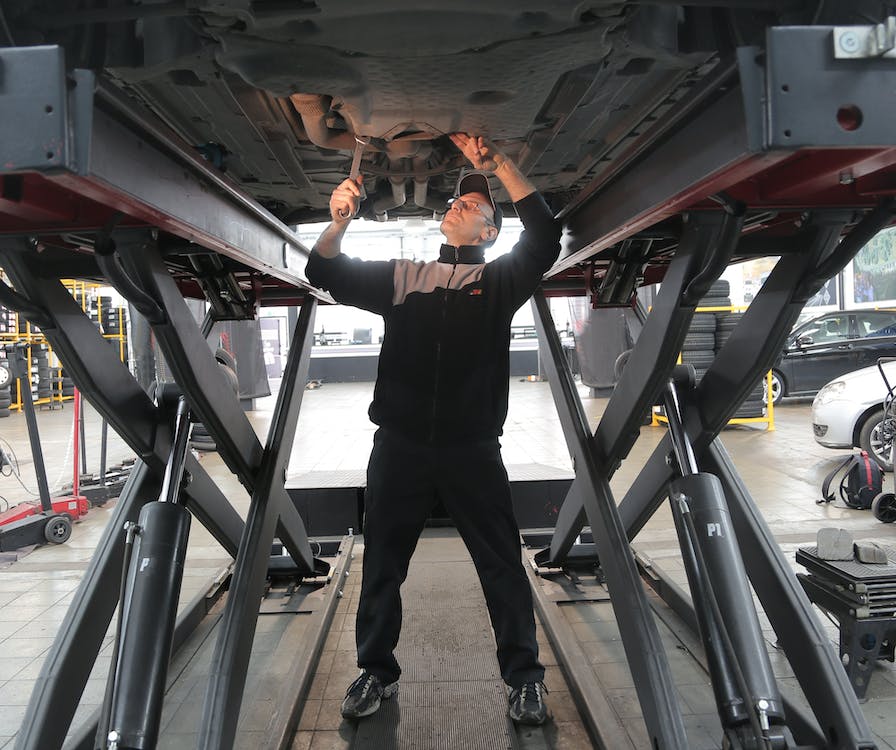 mechanic working on car