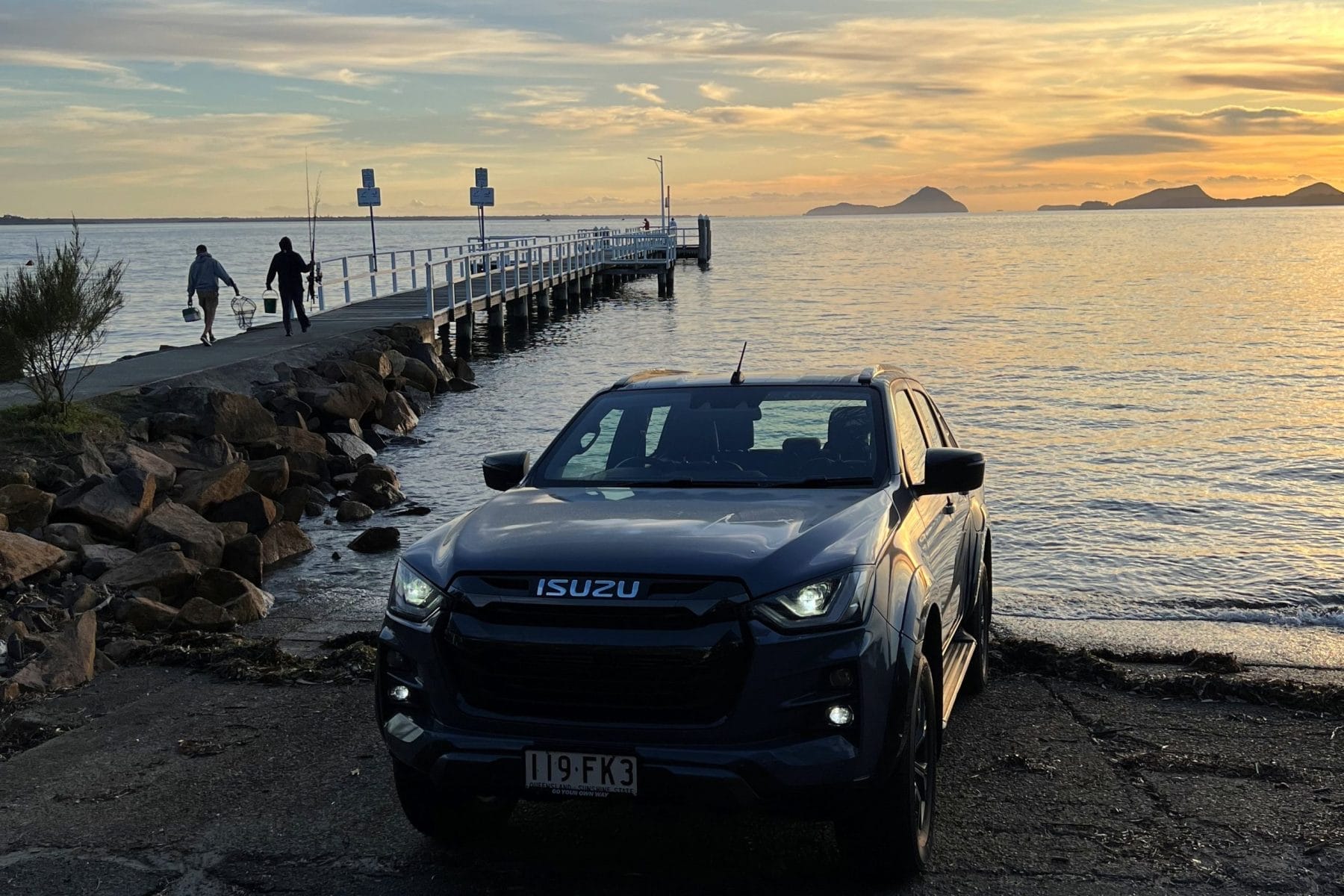 2023 Isuzu D-Max X-Terrain front quarter on boat ramp sunrise