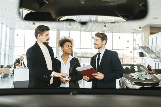 https://www.pexels.com/photo/a-salesman-talking-to-a-couple-7144253/