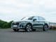 Audi Q5 Plug-In Hybrid 2023 front quarter green sportback