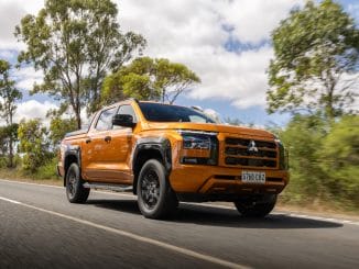 2024 Mitsubishi Triton GSR Yambuki Orange driving on road 1